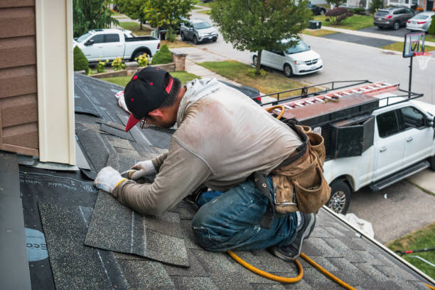 Professional Roofing technician working in Woodland, PA